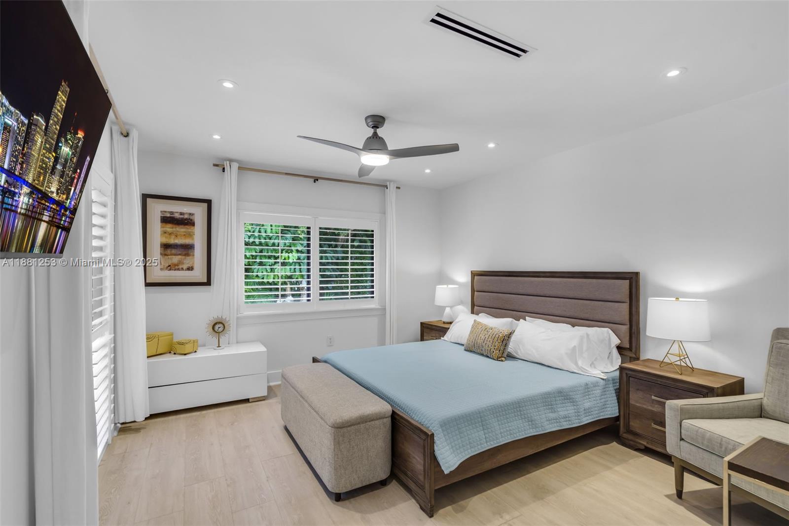 340 Woodcrest Road Key Biscayne, FL 33149 - Photo 16 of 51 a bedroom with a bed couch and window