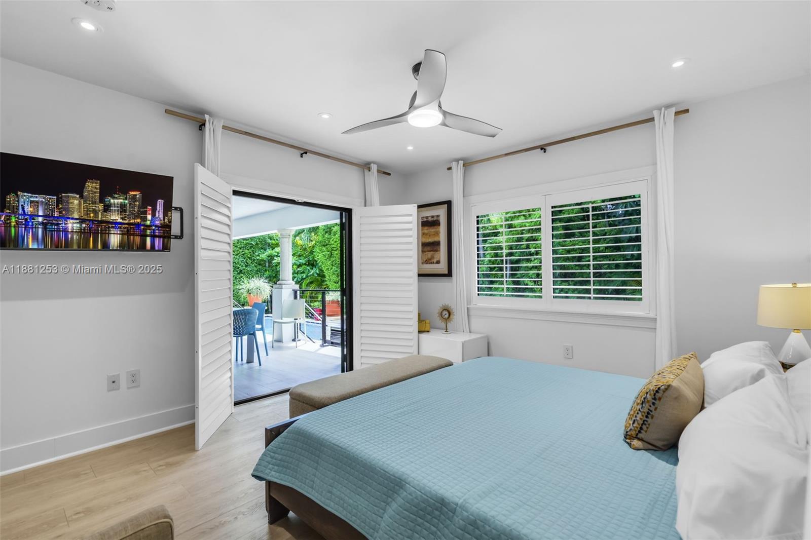 340 Woodcrest Road Key Biscayne, FL 33149 - Photo 18 of 51 a bedroom with a bed and a window