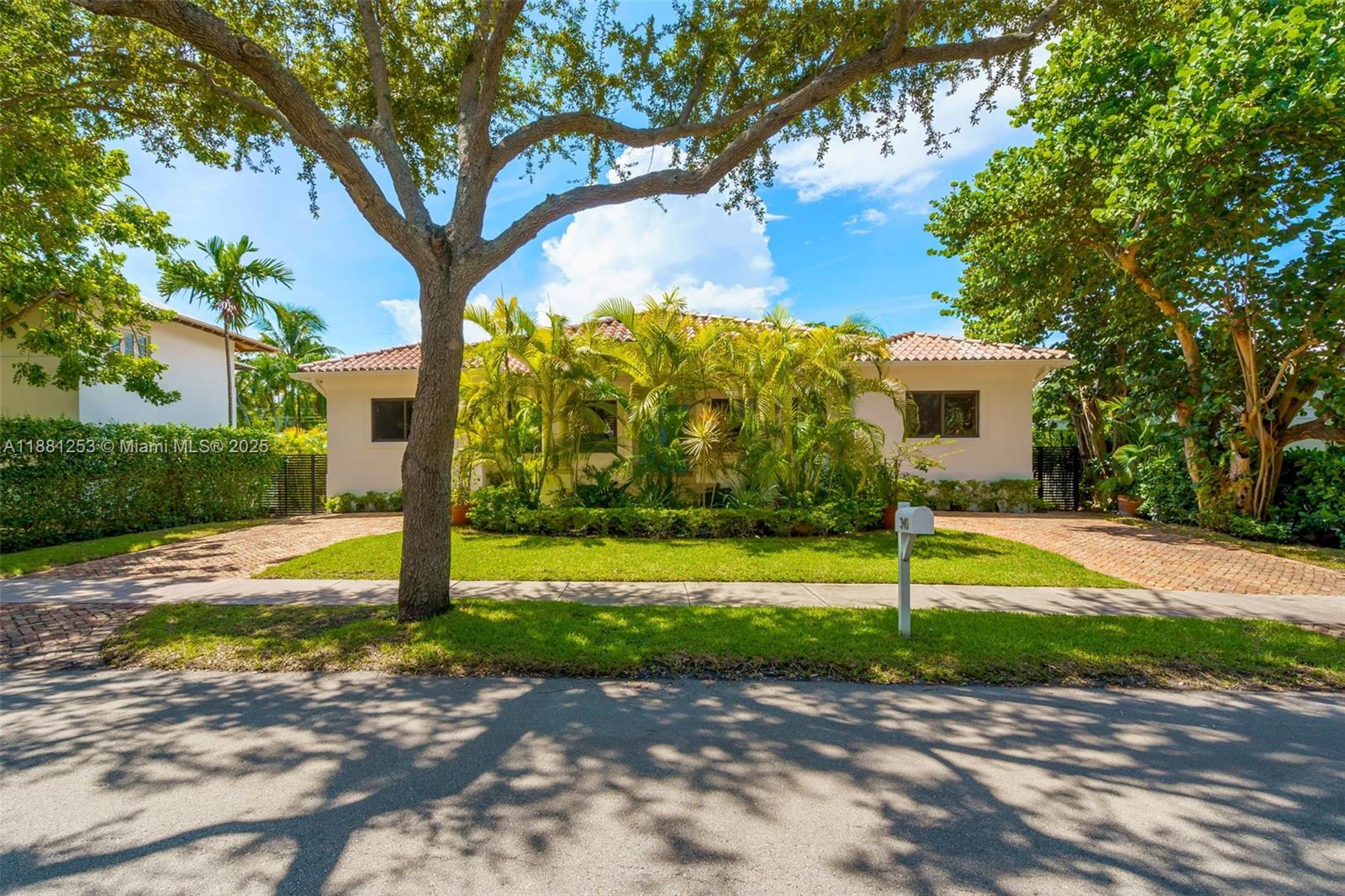 340 Woodcrest Road Key Biscayne, FL 33149 - Photo 2 of 51 a view of a backyard with green space