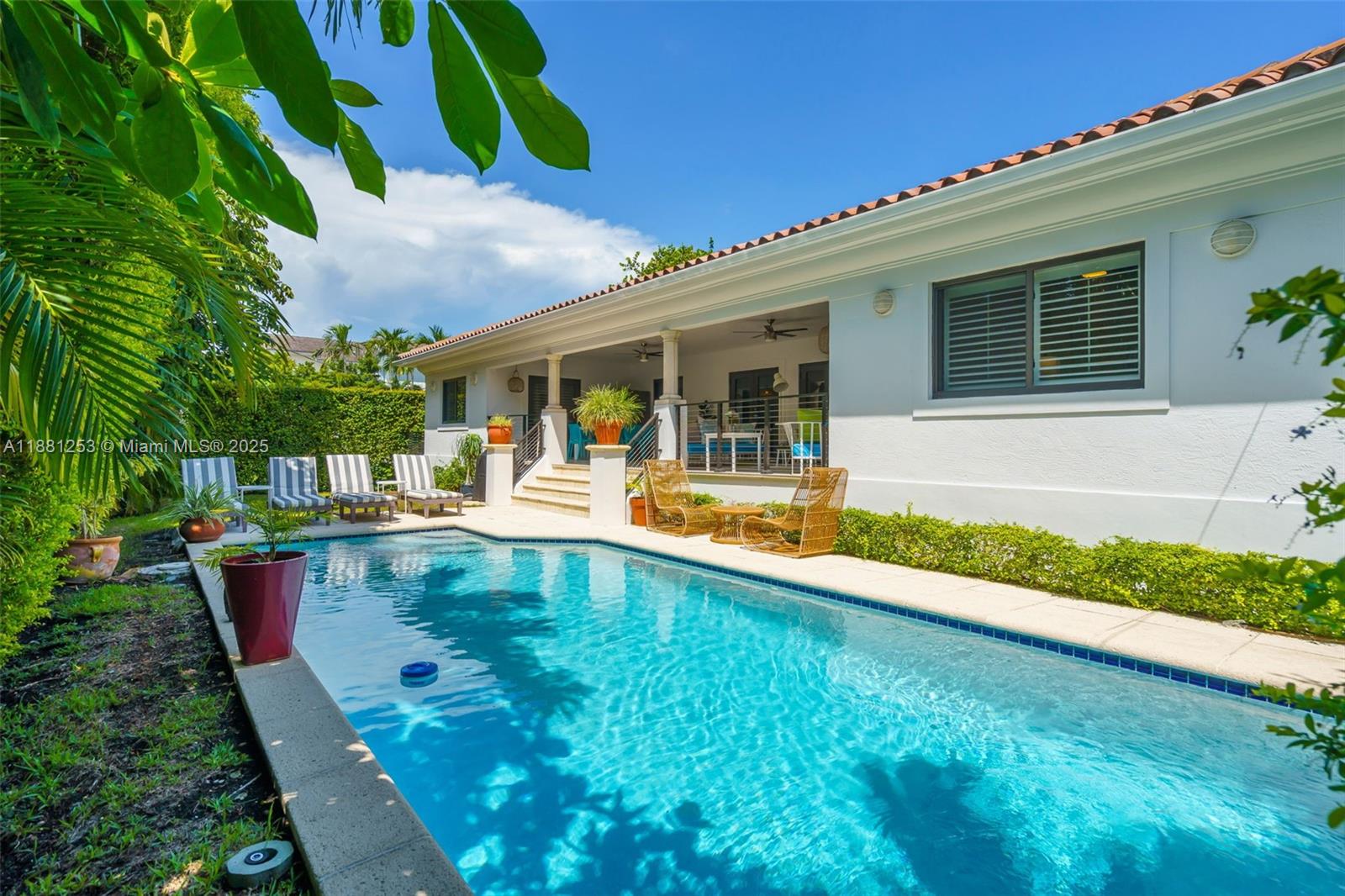 340 Woodcrest Road Key Biscayne, FL 33149 - Photo 26 of 51 a view of a house with pool porch and chairs