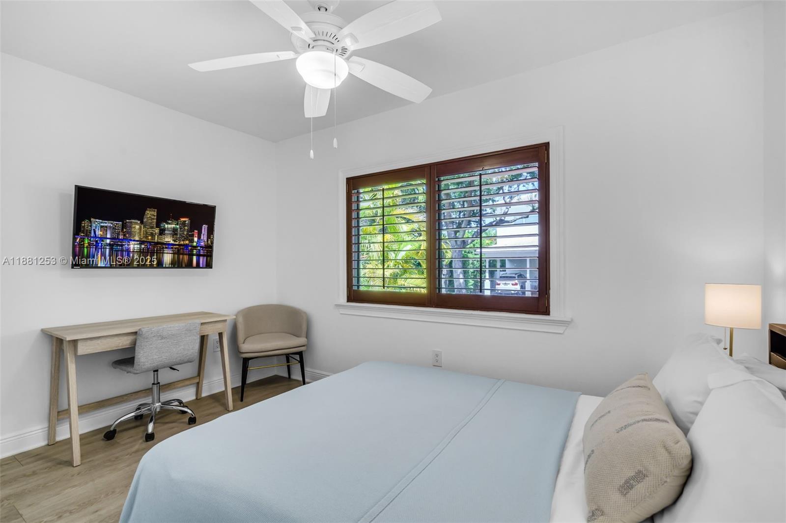 340 Woodcrest Road Key Biscayne, FL 33149 - Photo 29 of 51 a bedroom with a bed a desk and chair with window