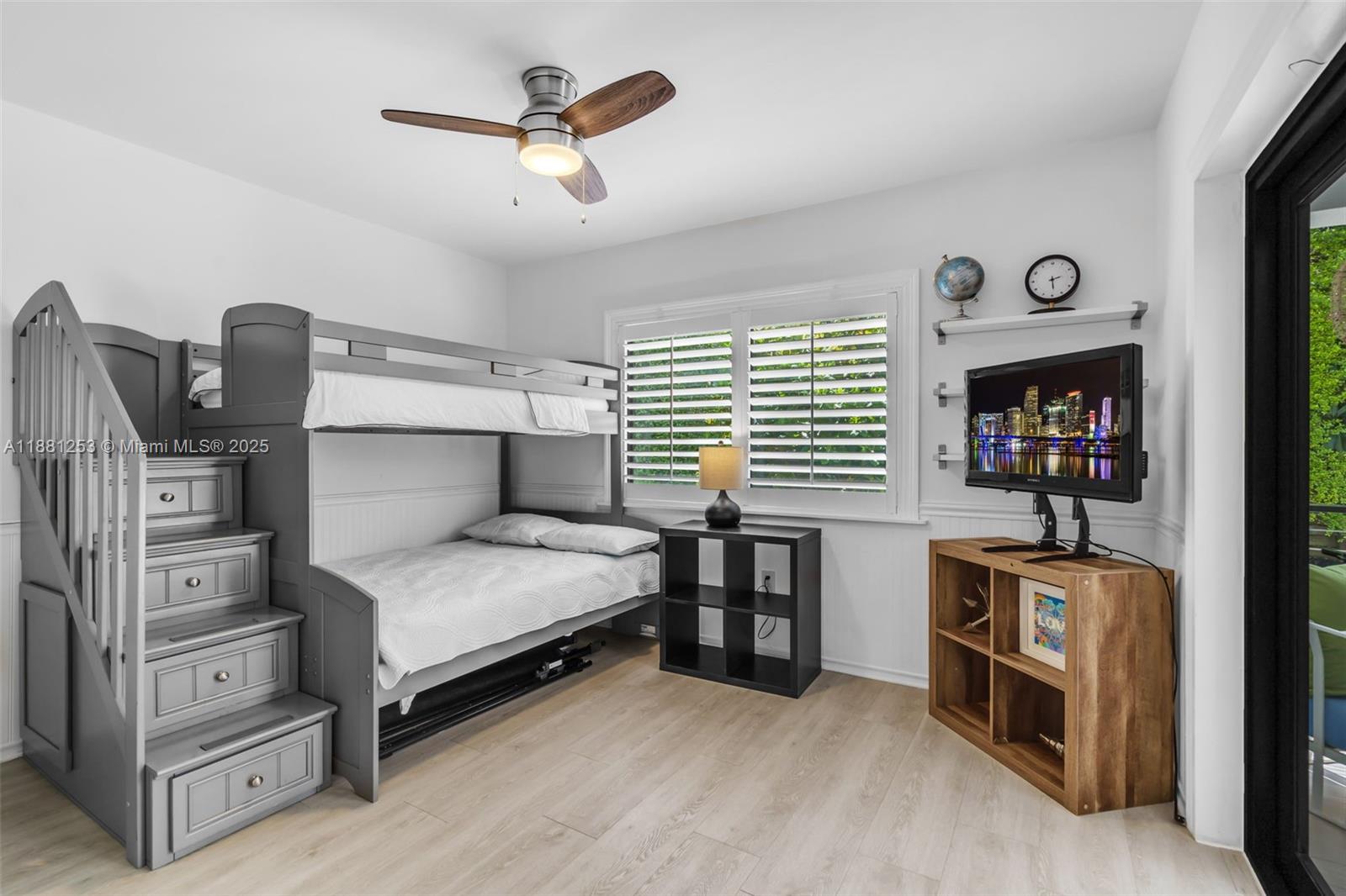 340 Woodcrest Road Key Biscayne, FL 33149 - Photo 31 of 51 a bedroom with furniture and a window