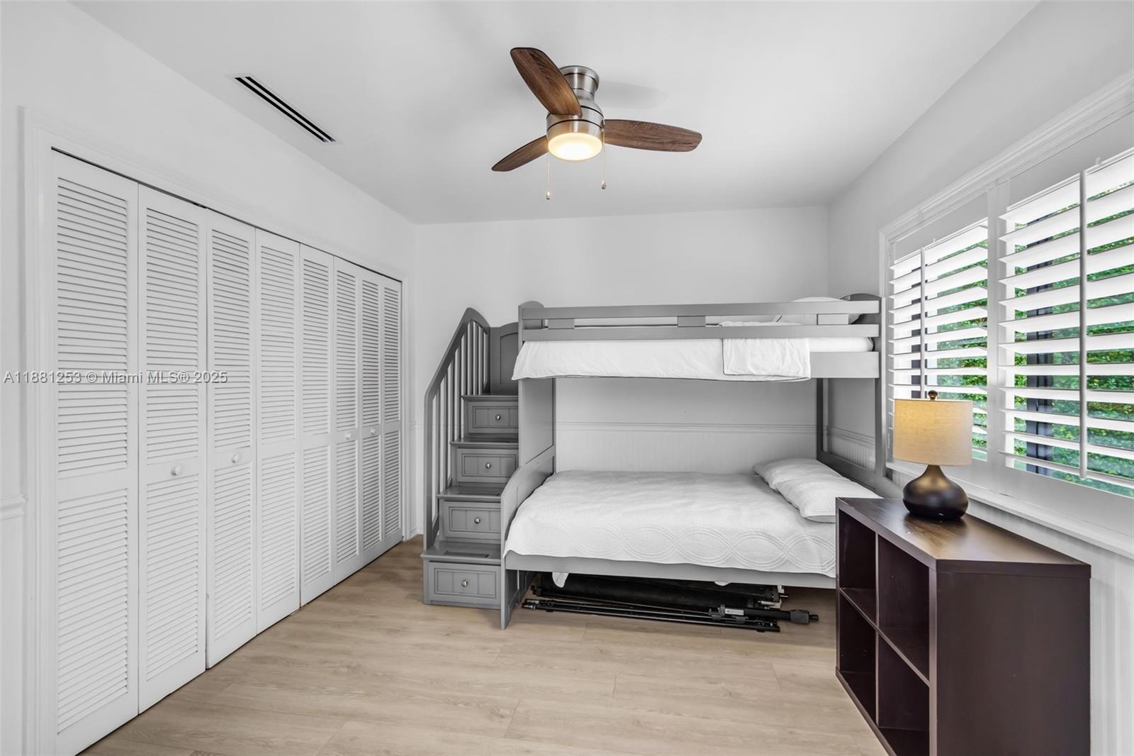 340 Woodcrest Road Key Biscayne, FL 33149 - Photo 32 of 51 a bedroom with a bed and a window