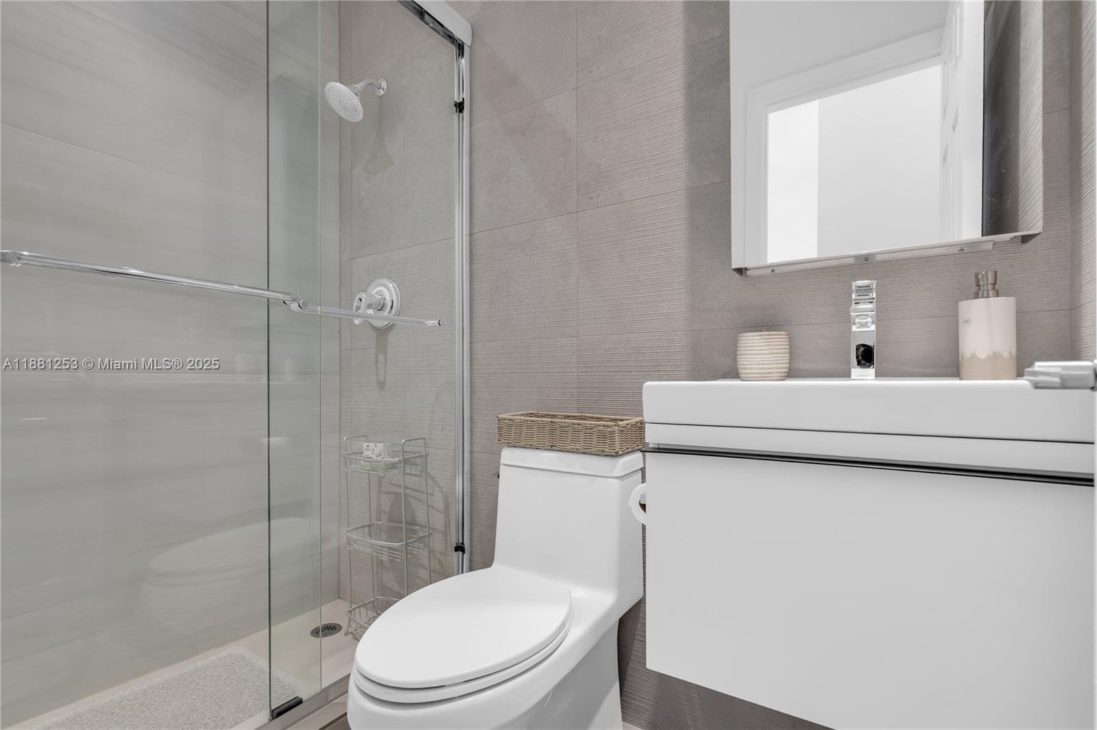 340 Woodcrest Road Key Biscayne, FL 33149 - Photo 36 of 51 a bathroom with a toilet sink vanity and shower