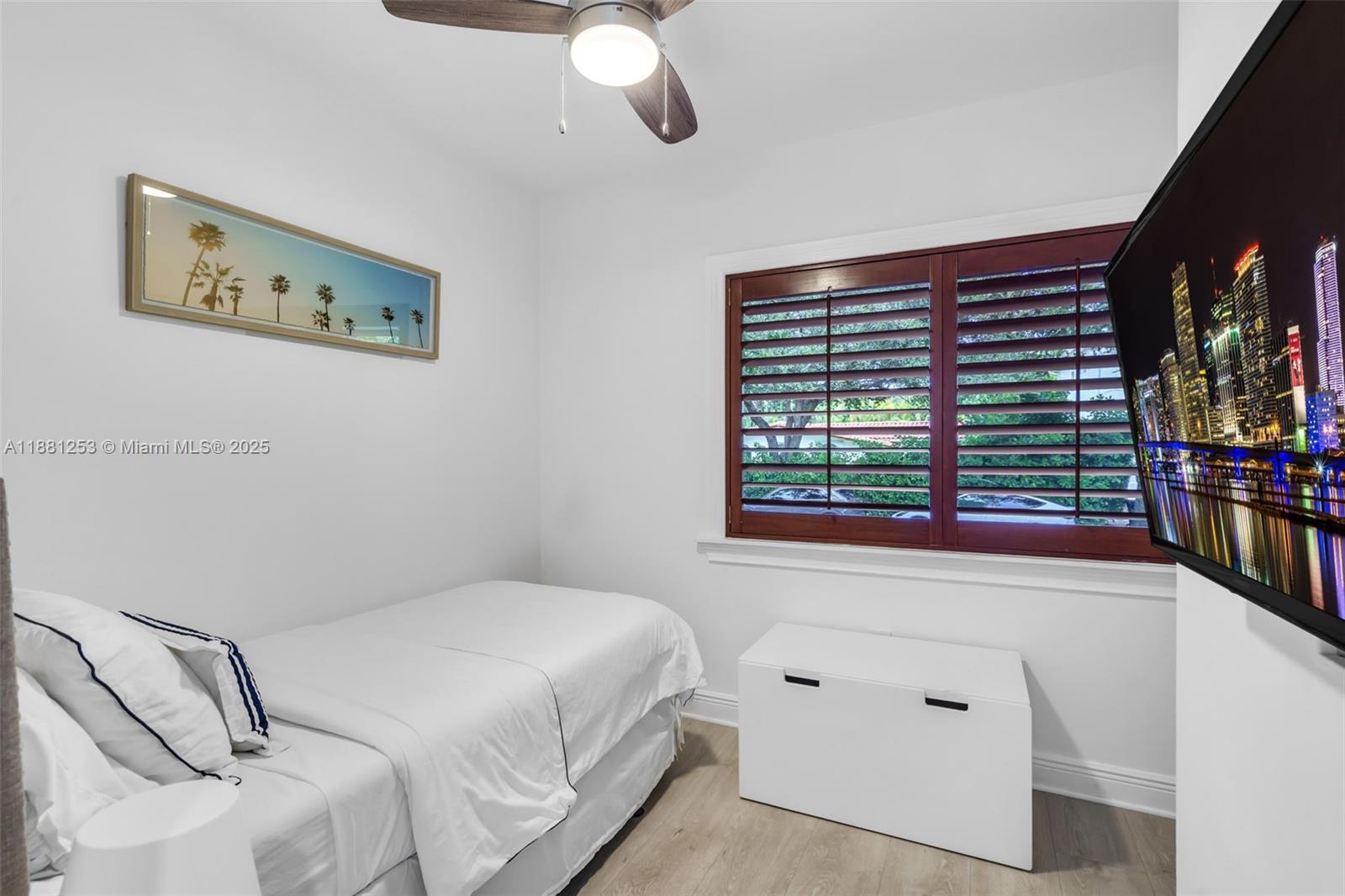 340 Woodcrest Road Key Biscayne, FL 33149 - Photo 37 of 51 a bedroom with a bed and a window