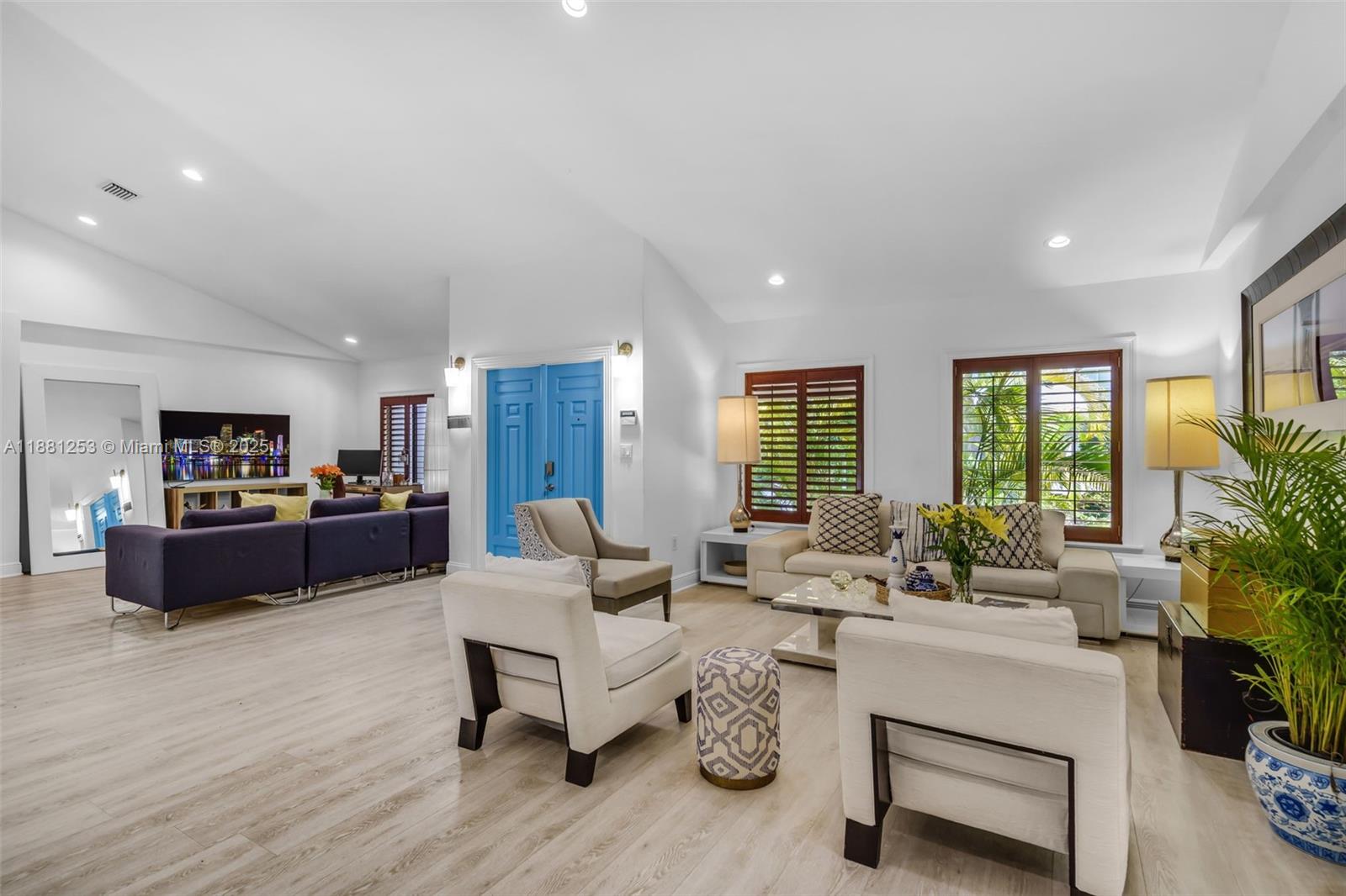 340 Woodcrest Road Key Biscayne, FL 33149 - Photo 4 of 51 a living room with furniture wooden floor and a large window