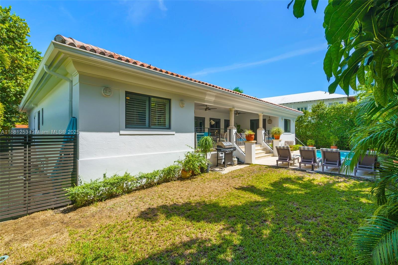 340 Woodcrest Road Key Biscayne, FL 33149 - Photo 42 of 51 a view of a house with a patio