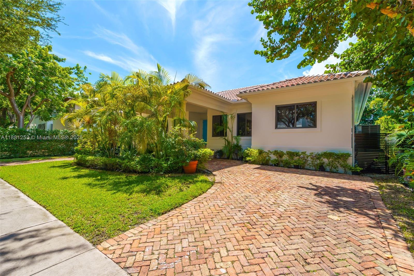 340 Woodcrest Road Key Biscayne, FL 33149 - Photo 45 of 51 a front view of a house with a garden