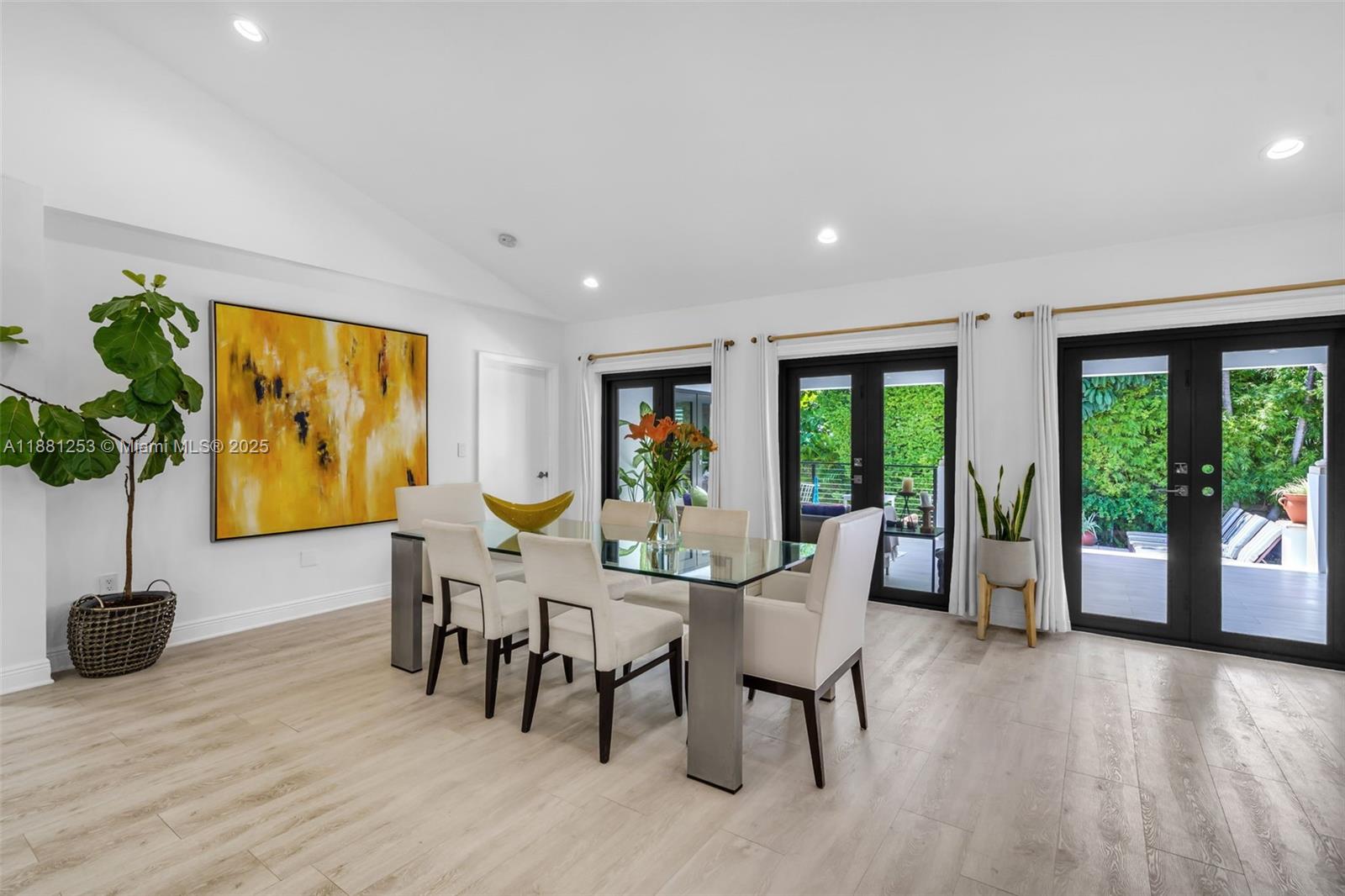 340 Woodcrest Road Key Biscayne, FL 33149 - Photo 8 of 51 a view of a dining room with furniture window and wooden floor