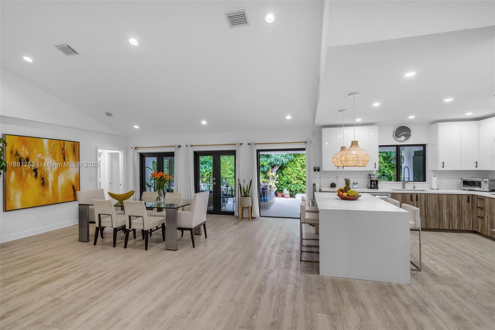 340 Woodcrest Road Key Biscayne, FL 33149 - Photo 10 of 51 a view of a dining hall with furniture and wooden floor