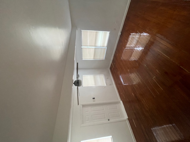 3411 Lyons Road Austin, TX 78702 - Photo 7 of 12 a view of empty room with wooden floor and fan