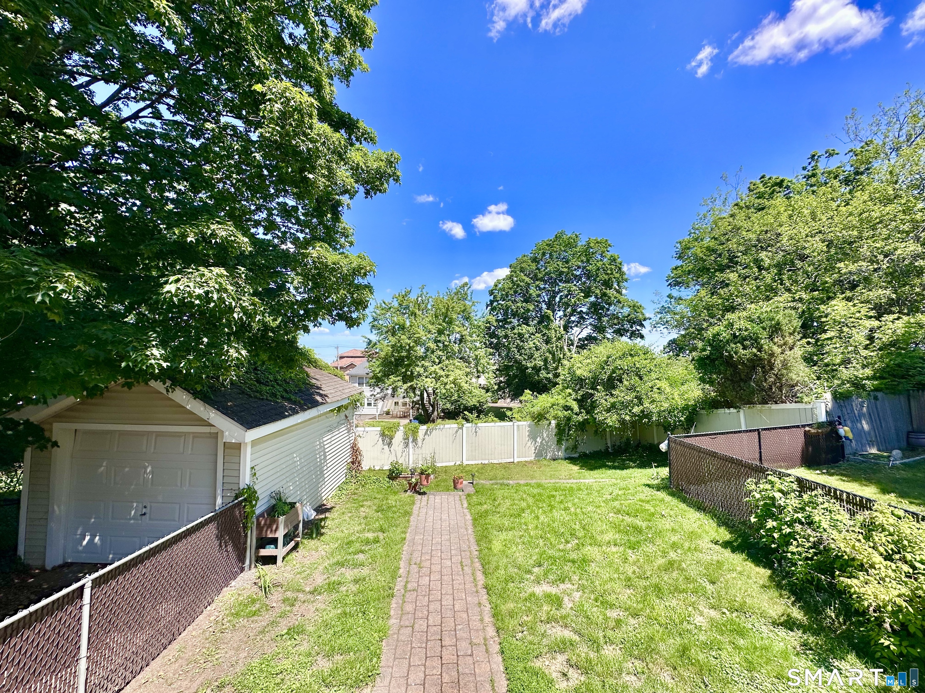 416 Lighthouse Road New Haven, CT 06512 - Photo 22 of 24 Two level back yard with water view and detached garage