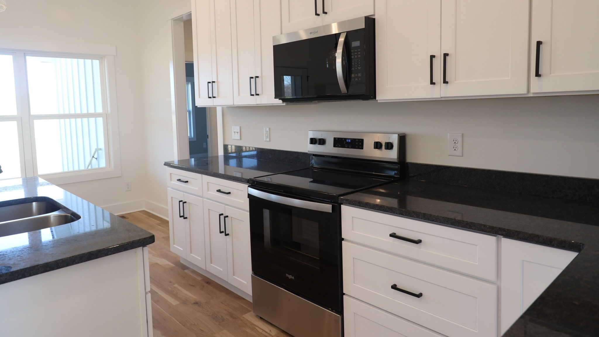 5558 Borthick Road Springfield, TN 37172 - Photo 14 of 53 a kitchen with stainless steel appliances white cabinets and a stove