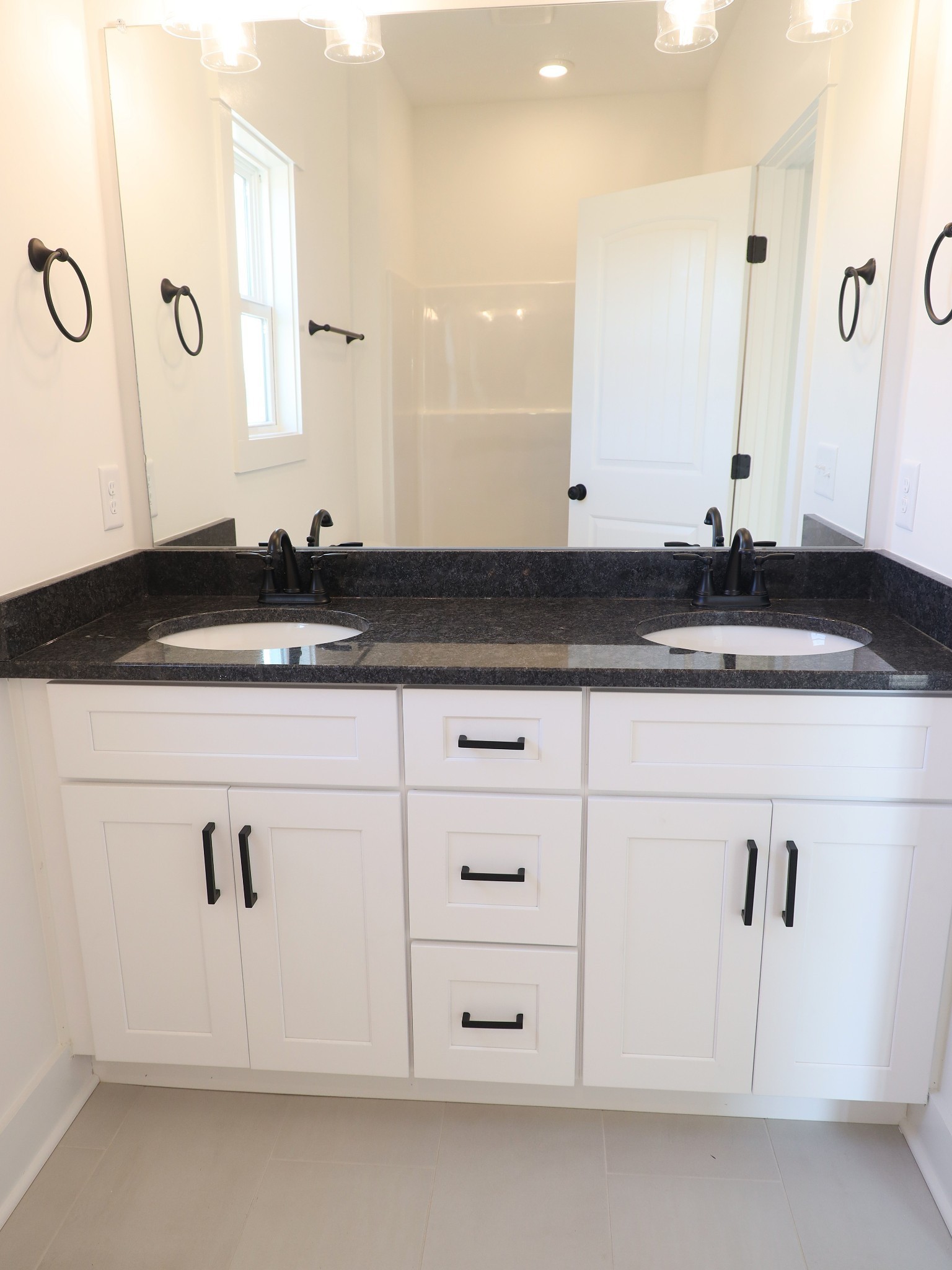 5558 Borthick Road Springfield, TN 37172 - Photo 33 of 53 a bathroom with a granite countertop sink and a mirror