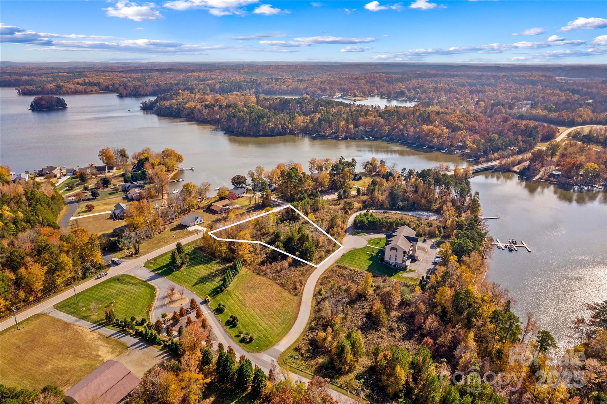 an aerial view of a house with a lake view