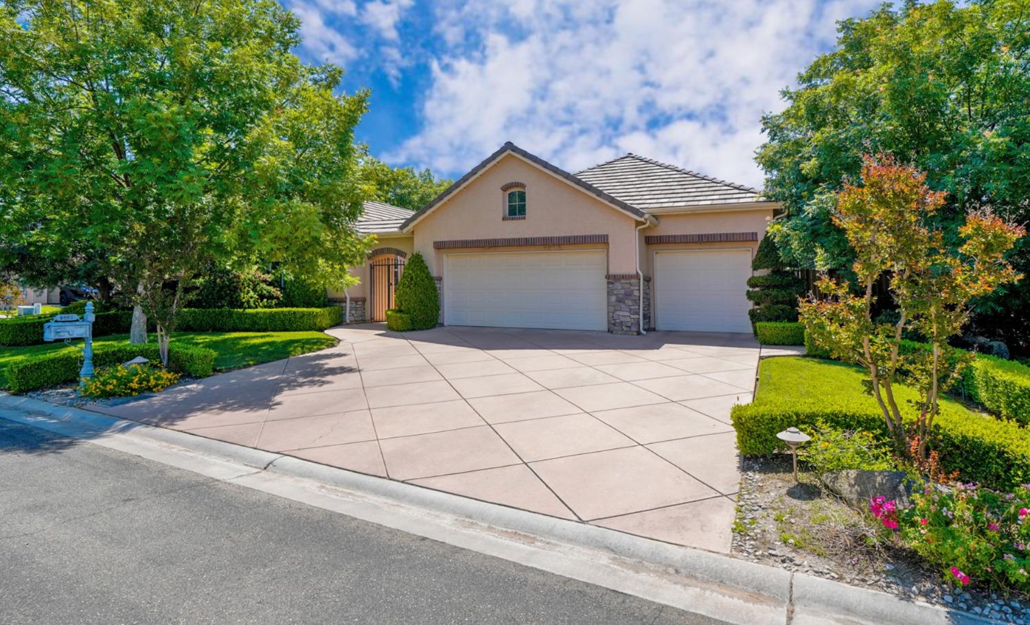 4224 Montego Lane Clovis, CA 93619 - Photo 1 of 1 a house with trees in front of it