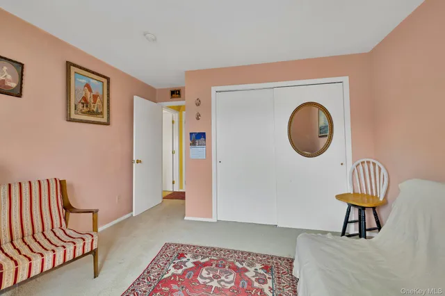 a living room with furniture and a chair