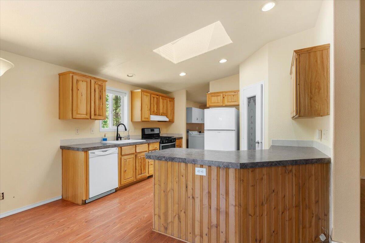 15288 Sherwood Forrest Road Oak Run, CA 96069 - Photo 12 of 91 a kitchen with stainless steel appliances granite countertop a refrigerator and a stove top oven