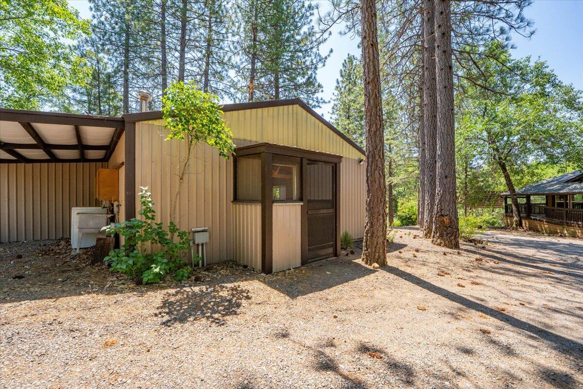 15288 Sherwood Forrest Road Oak Run, CA 96069 - Photo 26 of 91 a front view of a house having yard