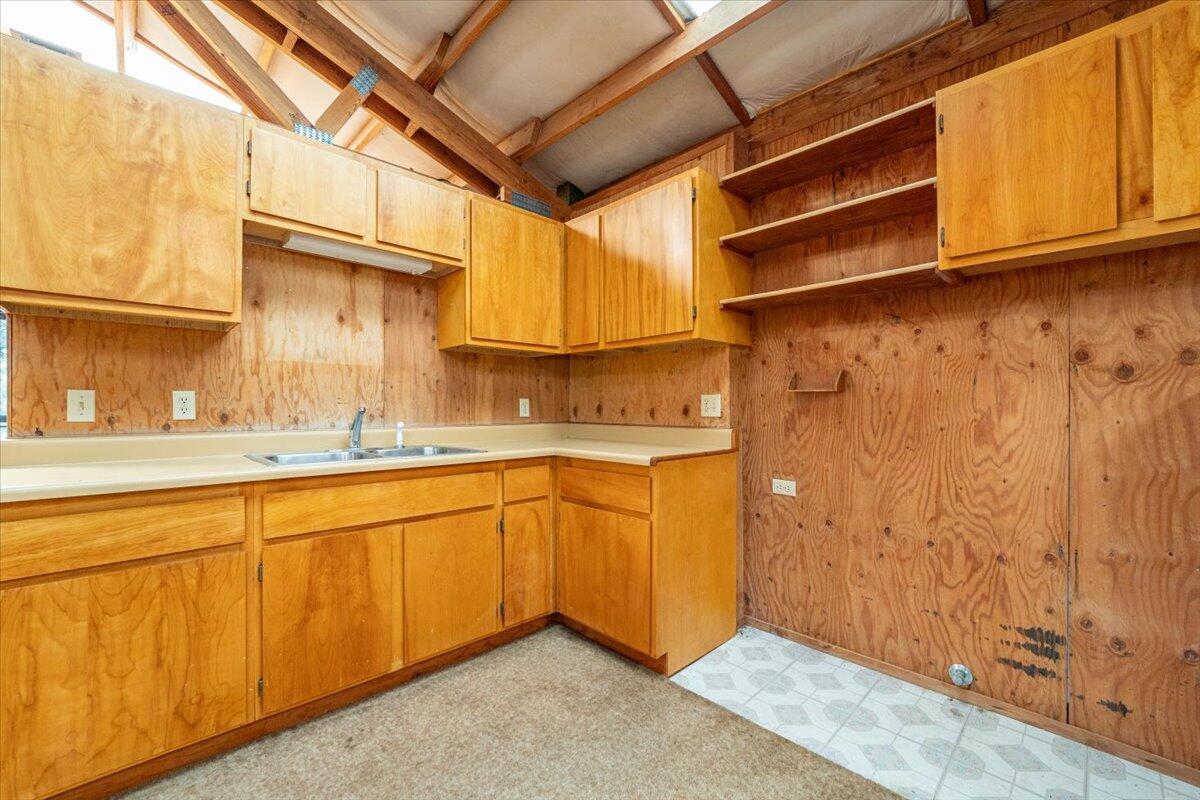 15288 Sherwood Forrest Road Oak Run, CA 96069 - Photo 34 of 91 a kitchen with a sink and cabinets