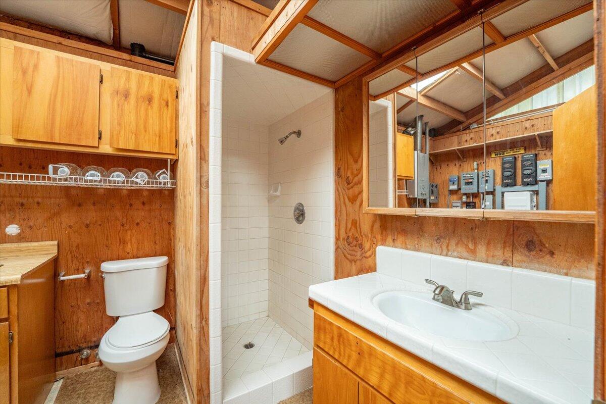 15288 Sherwood Forrest Road Oak Run, CA 96069 - Photo 36 of 91 a bathroom with a sink a toilet and shower