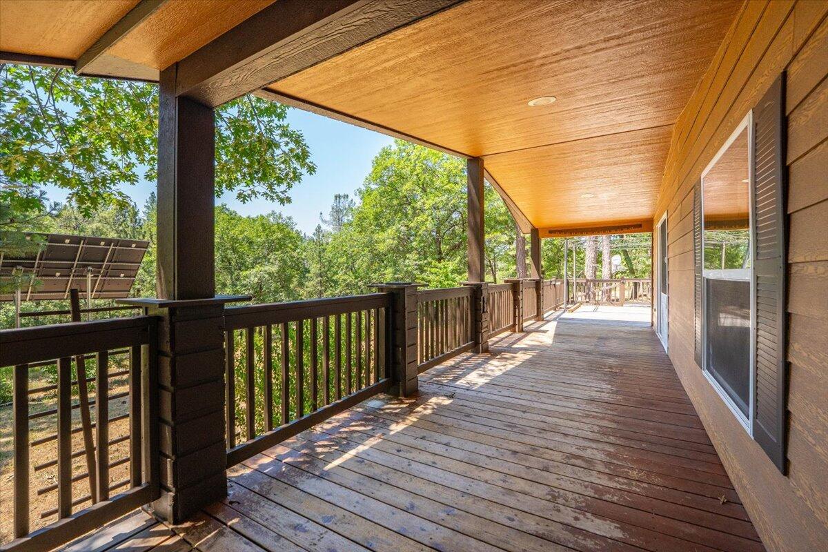 15288 Sherwood Forrest Road Oak Run, CA 96069 - Photo 60 of 91 a view of a two room with wooden floor and iron stairs