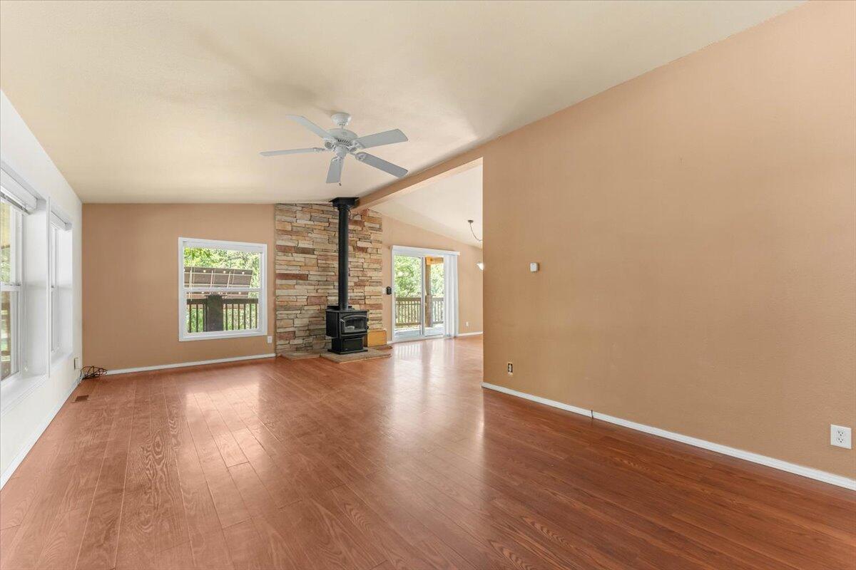 15288 Sherwood Forrest Road Oak Run, CA 96069 - Photo 8 of 91 wooden floor in an empty room with a window