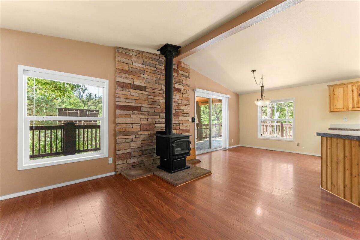 15288 Sherwood Forrest Road Oak Run, CA 96069 - Photo 9 of 91 a view of an empty room with wooden floor and a window