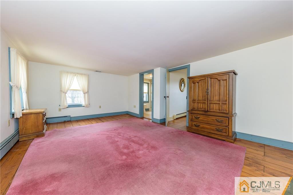 78 Yard Road Stockton, NJ 08559 - Photo 13 of 25 an empty room with windows and closet