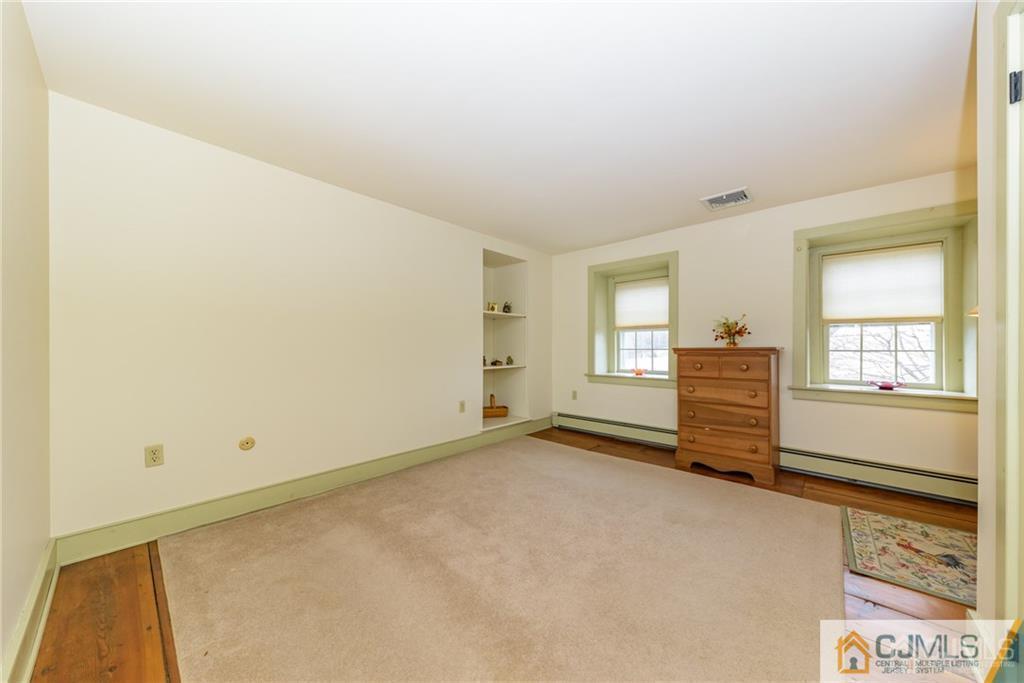 78 Yard Road Stockton, NJ 08559 - Photo 16 of 25 an empty room with windows