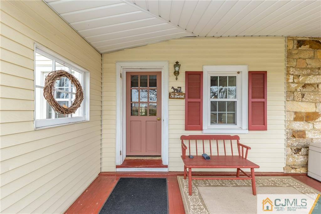 78 Yard Road Stockton, NJ 08559 - Photo 2 of 25 a front view of a house with a large window