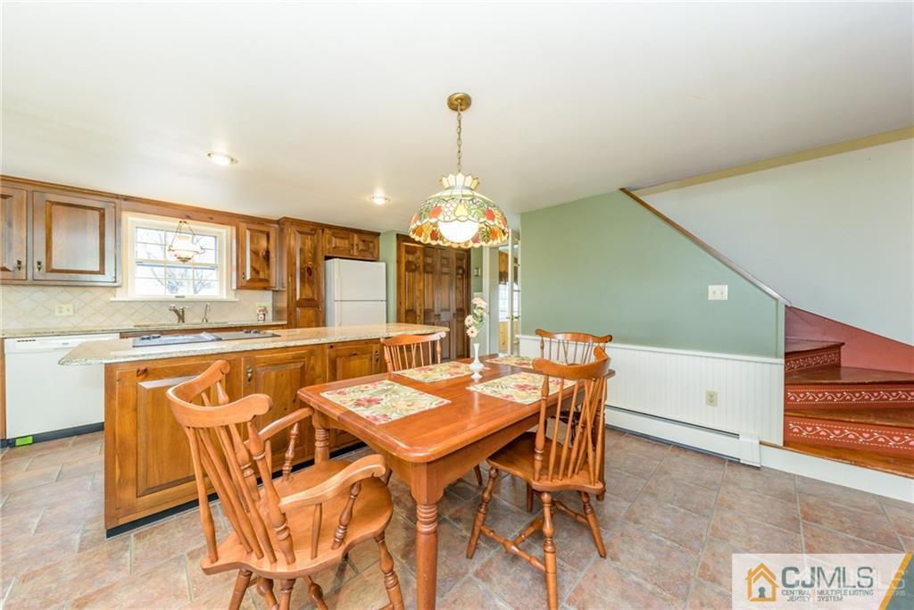 78 Yard Road Stockton, NJ 08559 - Photo 5 of 25 a view of a dining room with furniture window and wooden floor