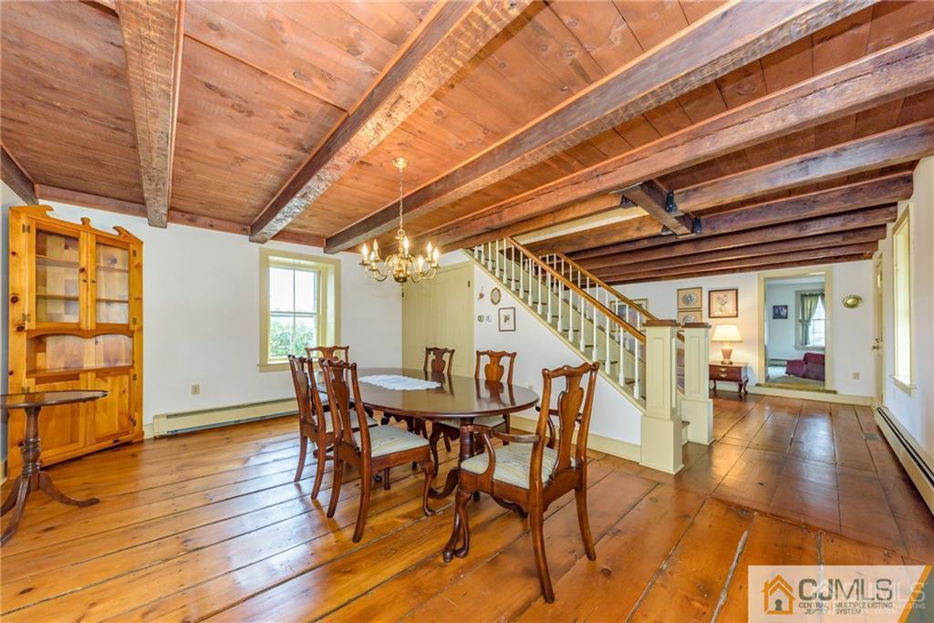 78 Yard Road Stockton, NJ 08559 - Photo 8 of 25 a view of a dining room with furniture and wooden floor