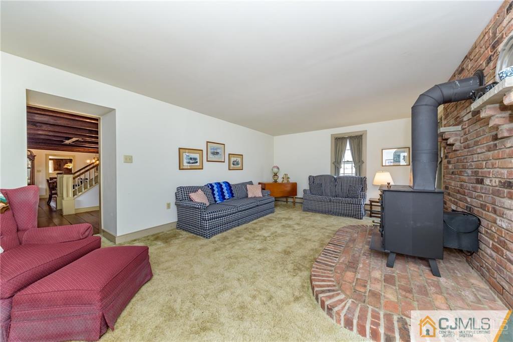 78 Yard Road Stockton, NJ 08559 - Photo 10 of 25 a living room with furniture and a fireplace