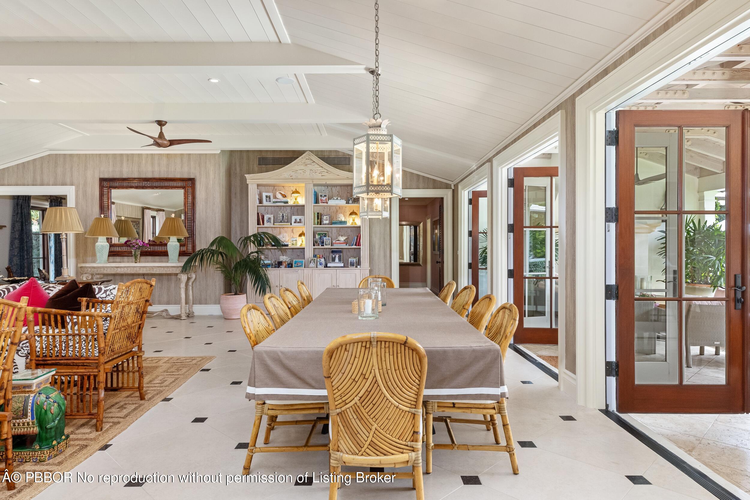 258 List Road Palm Beach, FL 33480 - Photo 10 of 45 a dining room with furniture a chandelier and wooden floor
