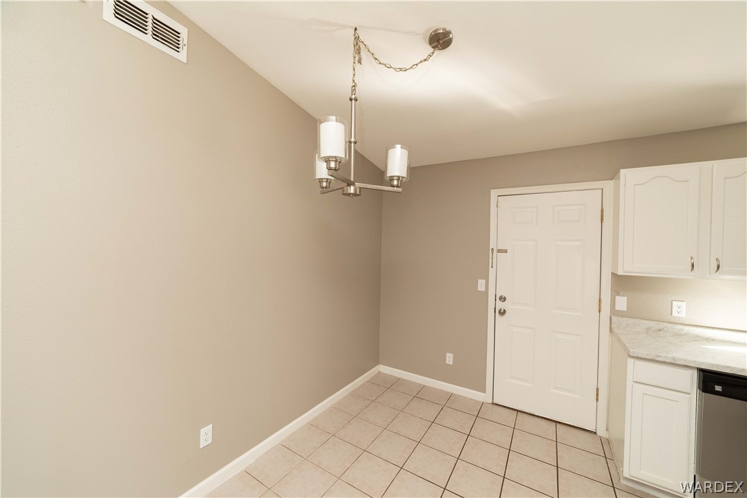 3556 North Willow Road Kingman, AZ 86409 - Photo 13 of 48 a view of a kitchen with a refrigerator and dishwasher
