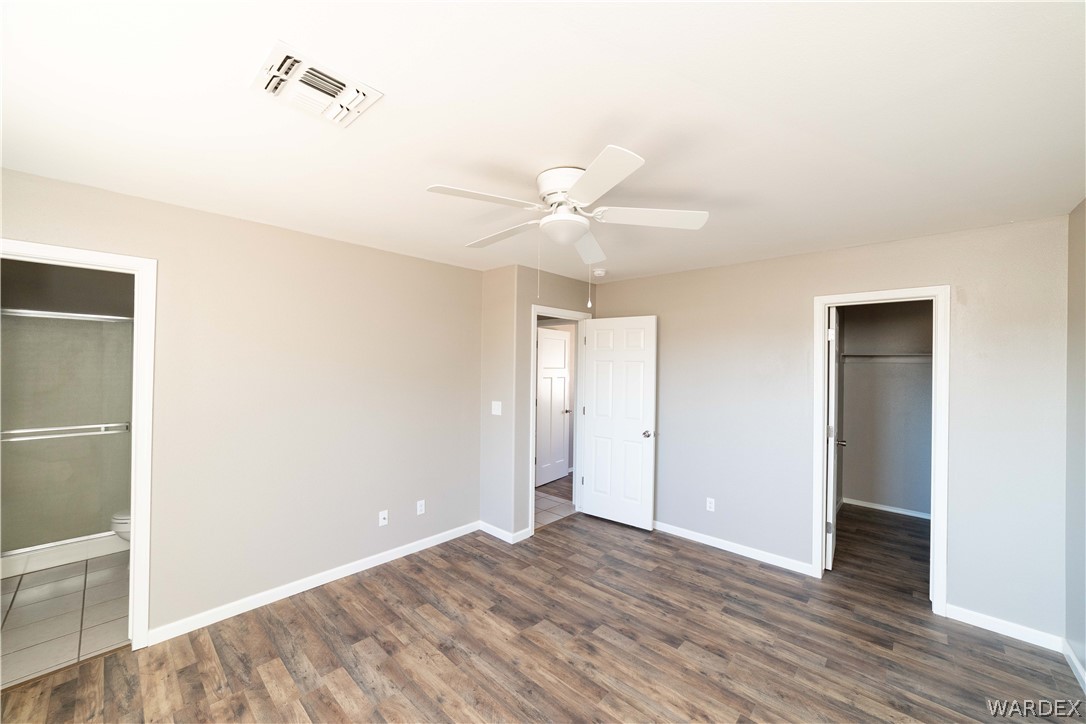 3556 North Willow Road Kingman, AZ 86409 - Photo 22 of 48 a view of an empty room with wooden floor