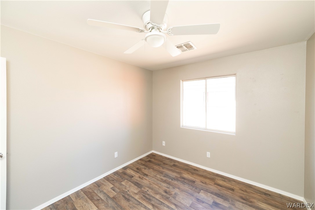 3556 North Willow Road Kingman, AZ 86409 - Photo 27 of 48 an empty room with windows and fan