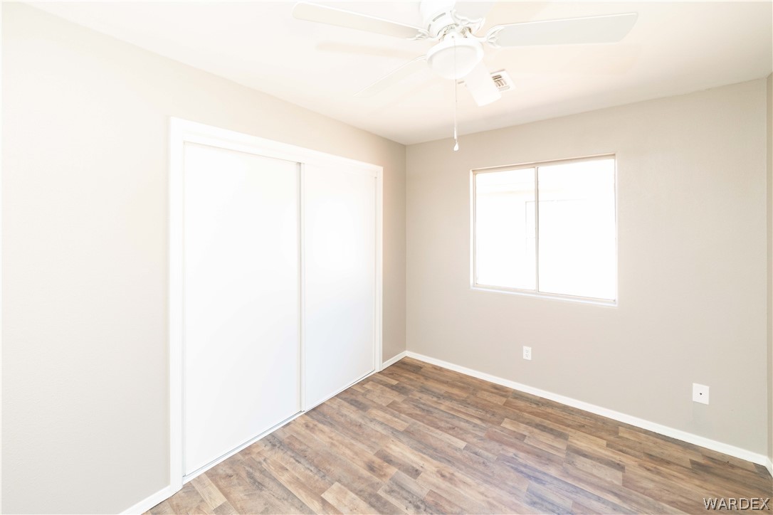 3556 North Willow Road Kingman, AZ 86409 - Photo 29 of 48 a view of a room with wooden floor and a window