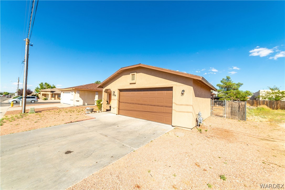 3556 North Willow Road Kingman, AZ 86409 - Photo 3 of 48 a view of yellow house with a outdoor space