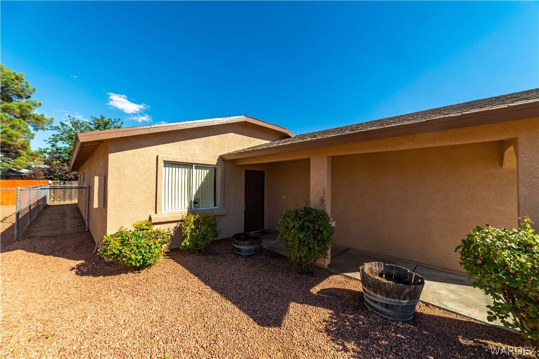 3556 North Willow Road Kingman, AZ 86409 - Photo 7 of 48 a view of a house with a yard
