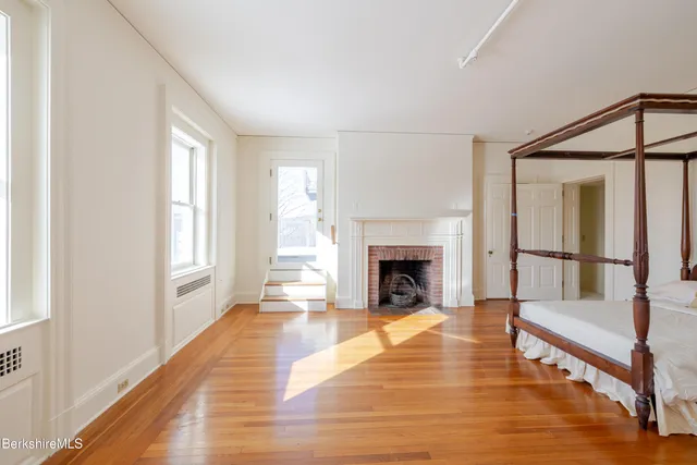 a view of a balcony with wooden floor