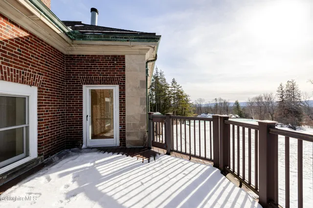 a view of balcony with wooden floor
