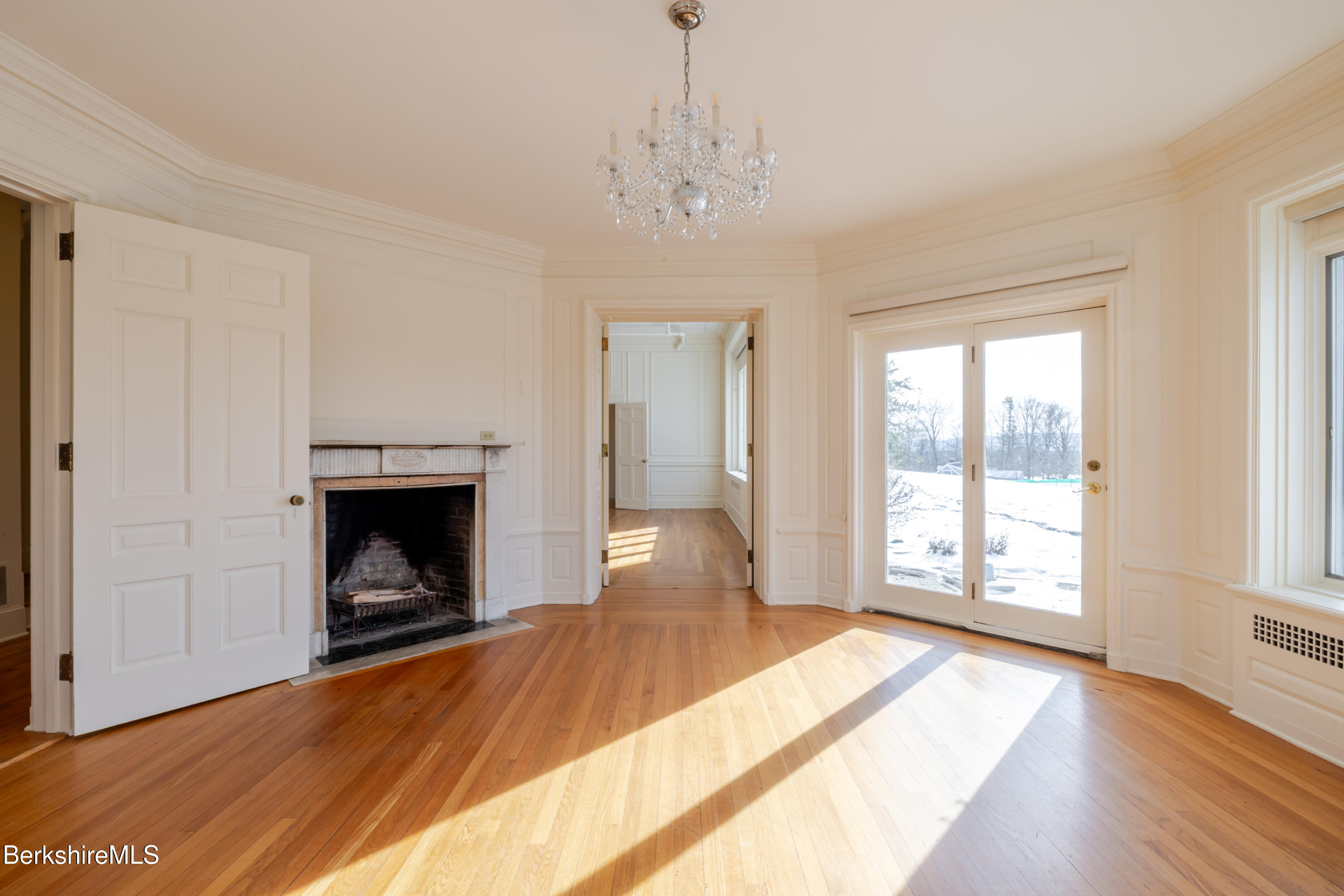 200 Old Stockbridge Road, Unit VANNA #3 Lenox, MA 01240 - Photo 9 of 29 a view of an empty room with wooden floor fireplace and a window