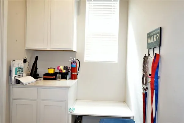 a view of a kitchen with appliances and a window