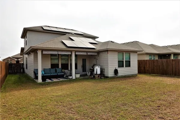 a front view of a house with a garden and porch