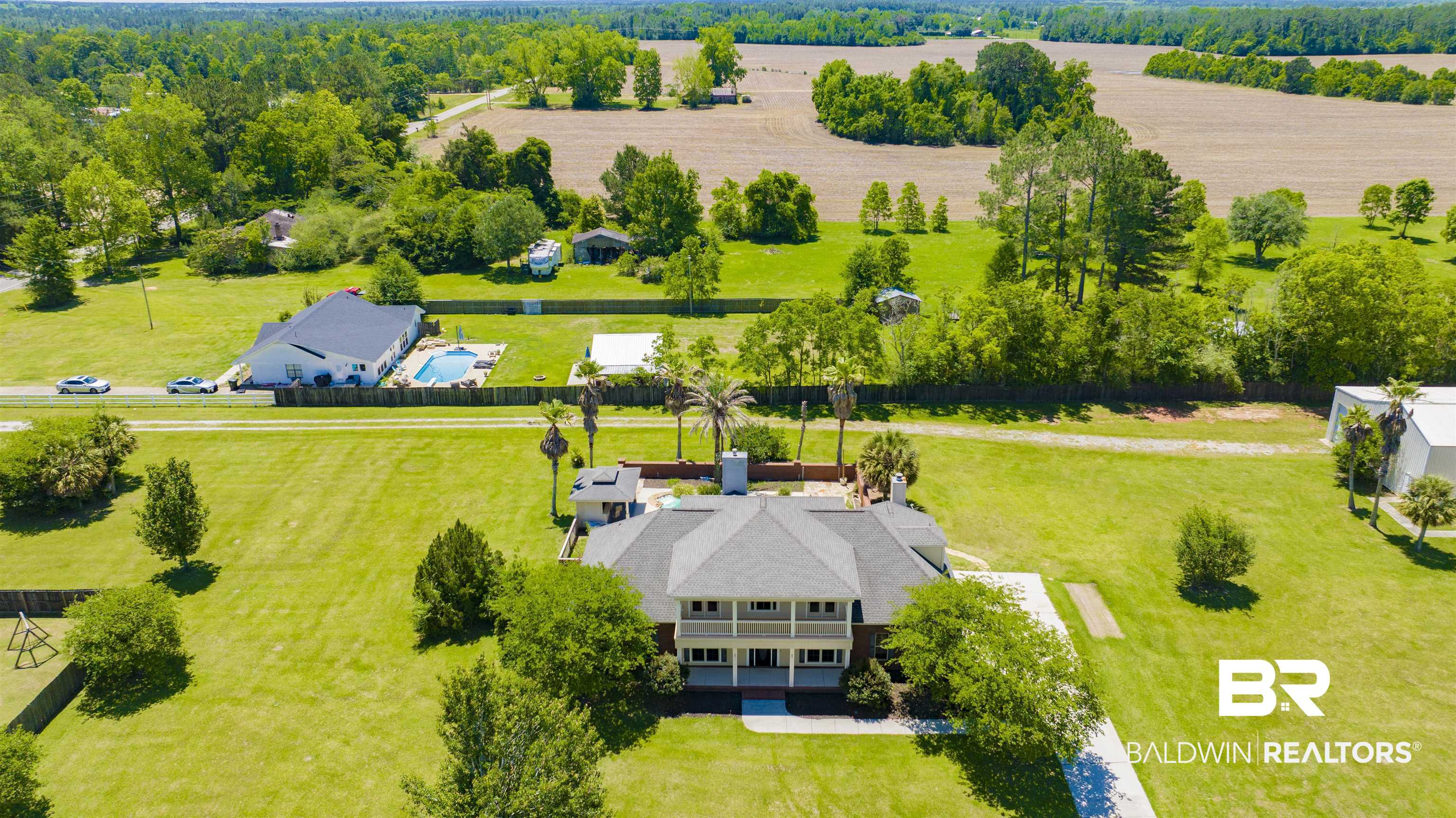 12944 Anna's Way Stapleton, AL 36578 - Photo 3 of 64 Expansive property featuring a two-story residence with a multi-gabled roofline and a large porch