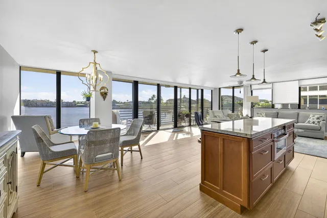 a kitchen with stainless steel appliances granite countertop a stove and cabinets