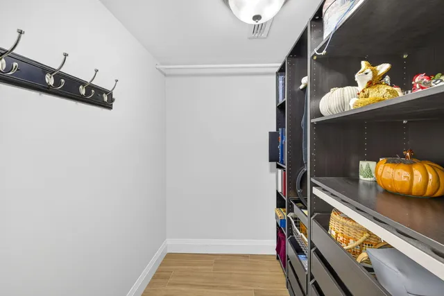 a view of a workspace with furniture and bathroom