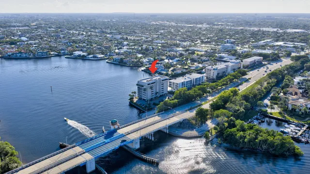 an aerial view of multiple houses with yard